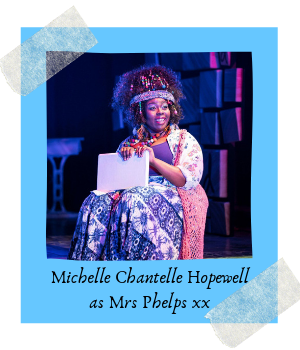 Photo from the musical. Caption reads: Michelle Chantelle Hopewell as Mrs Phelps xx