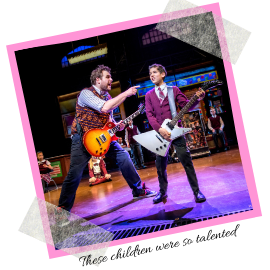 A picture of Dewy Finn and one of the children from School of Rock. Text reads: The childresn were so talented