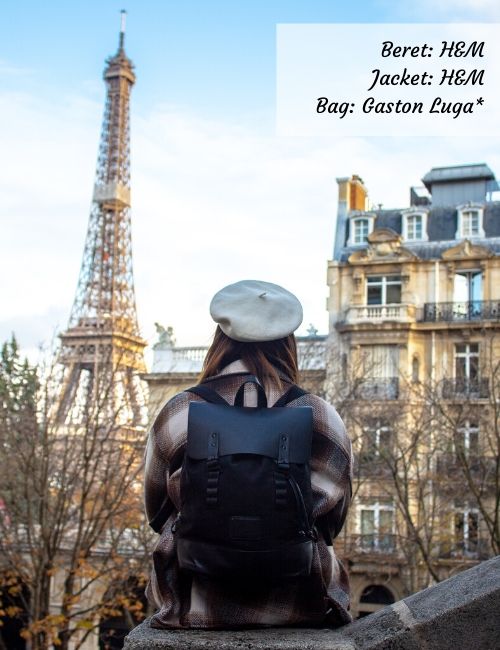 Shot of me in a black backpack from Gaston Luga, a white beret, and a checked jacket.