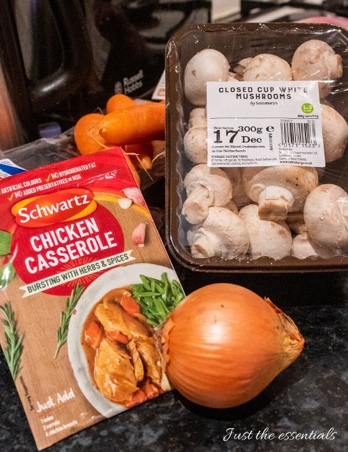 A photo of the ingredients (Featuring mushrooms, onions, Schwartz chicken casserole and carrots