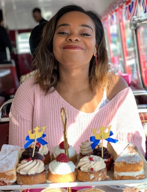 Photo of author with the food on the Brigits afternoon tea bus