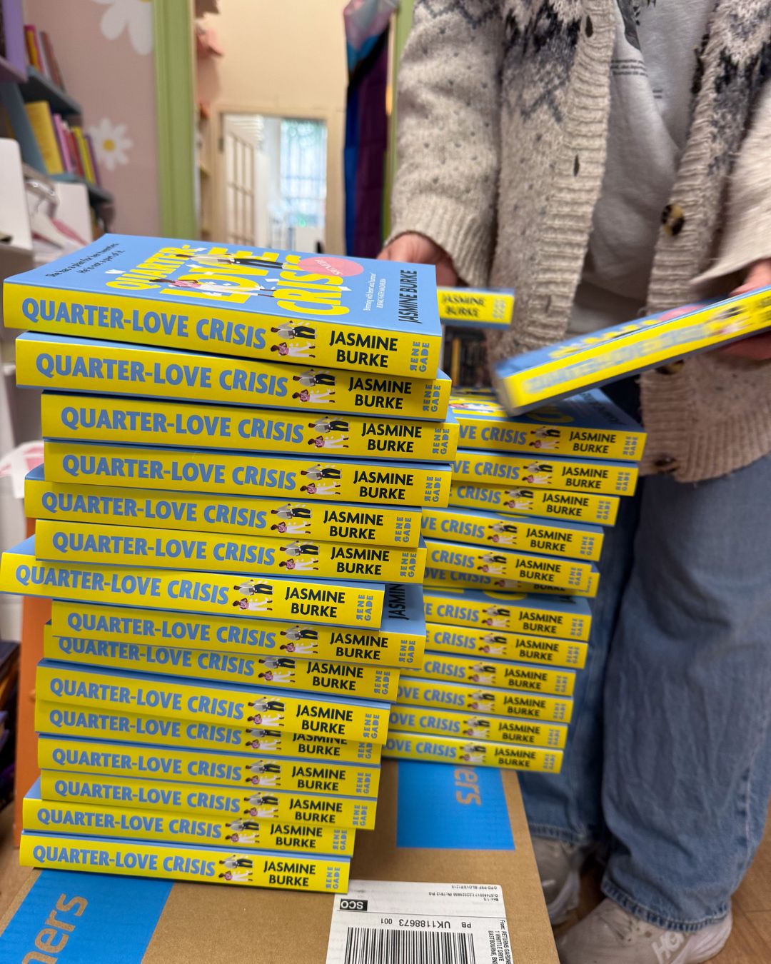 A stack of copies of my debut novel, Quarter-Love Crisis